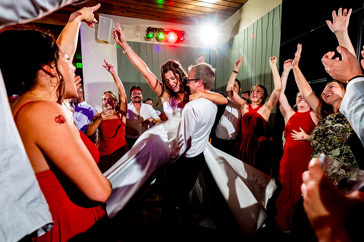 A bride and groom dancing together at their wedding reception in Estes Park