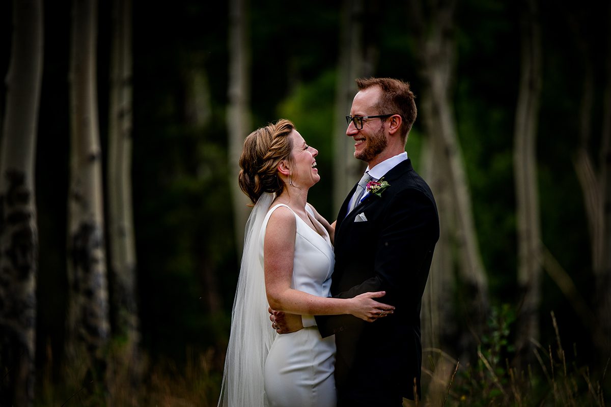 A close up image of a Bride and Groom on their wedding day in an Aspen forest