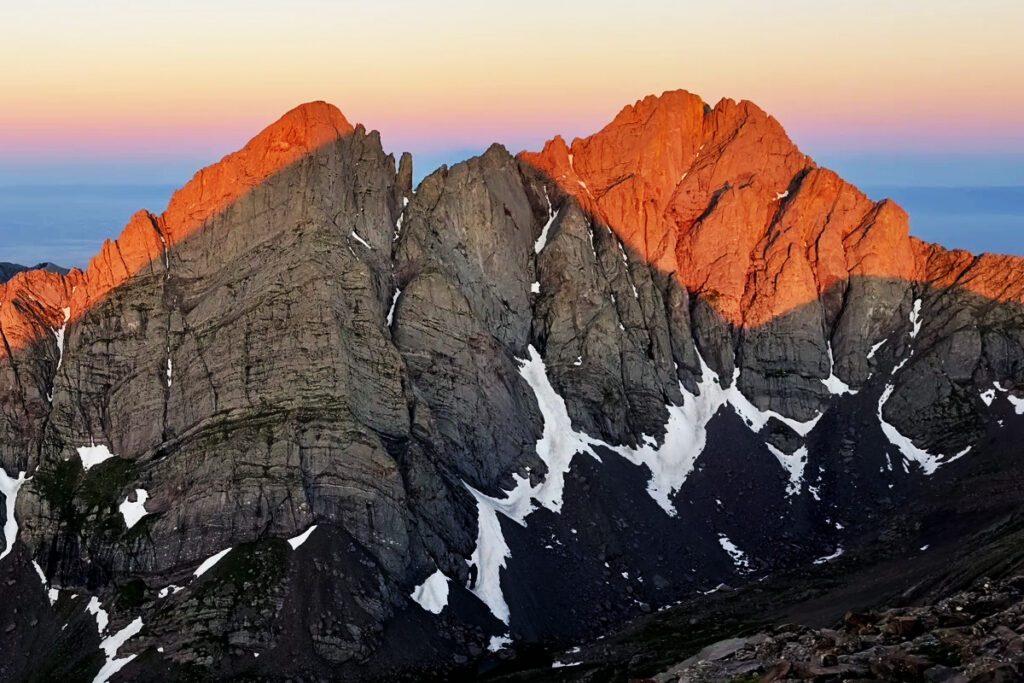 Looking out over the Crestone peaks from the summit of Humboldt Peak at sunrise