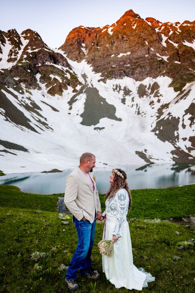 A bride and groom on their elopement day at sunrise in Velocity Basin near Silverton, Colorado